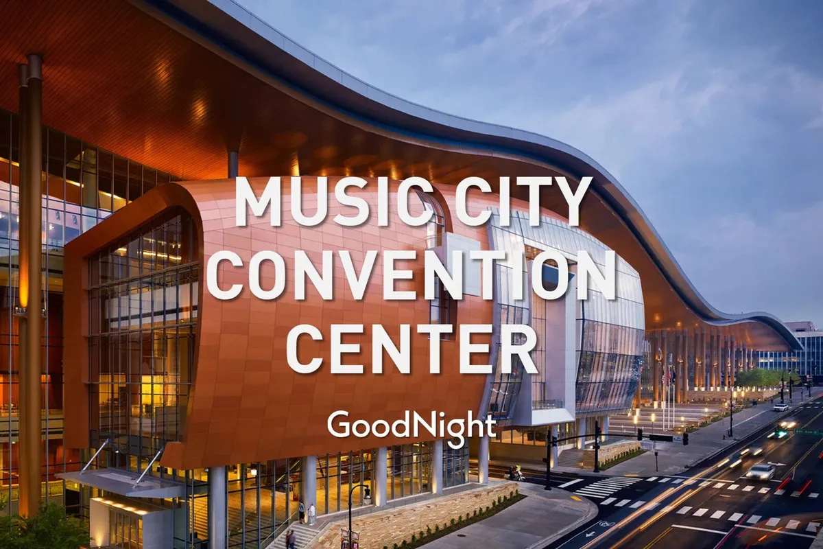 This image captures the dynamic exterior of the Music City Center, showcasing its unique architectural design and the wide, welcoming entrance. The vibrant colors and hustle around the convention center communicate activity and connectivity, anchoring the property's proximity to a key business and conference hub.